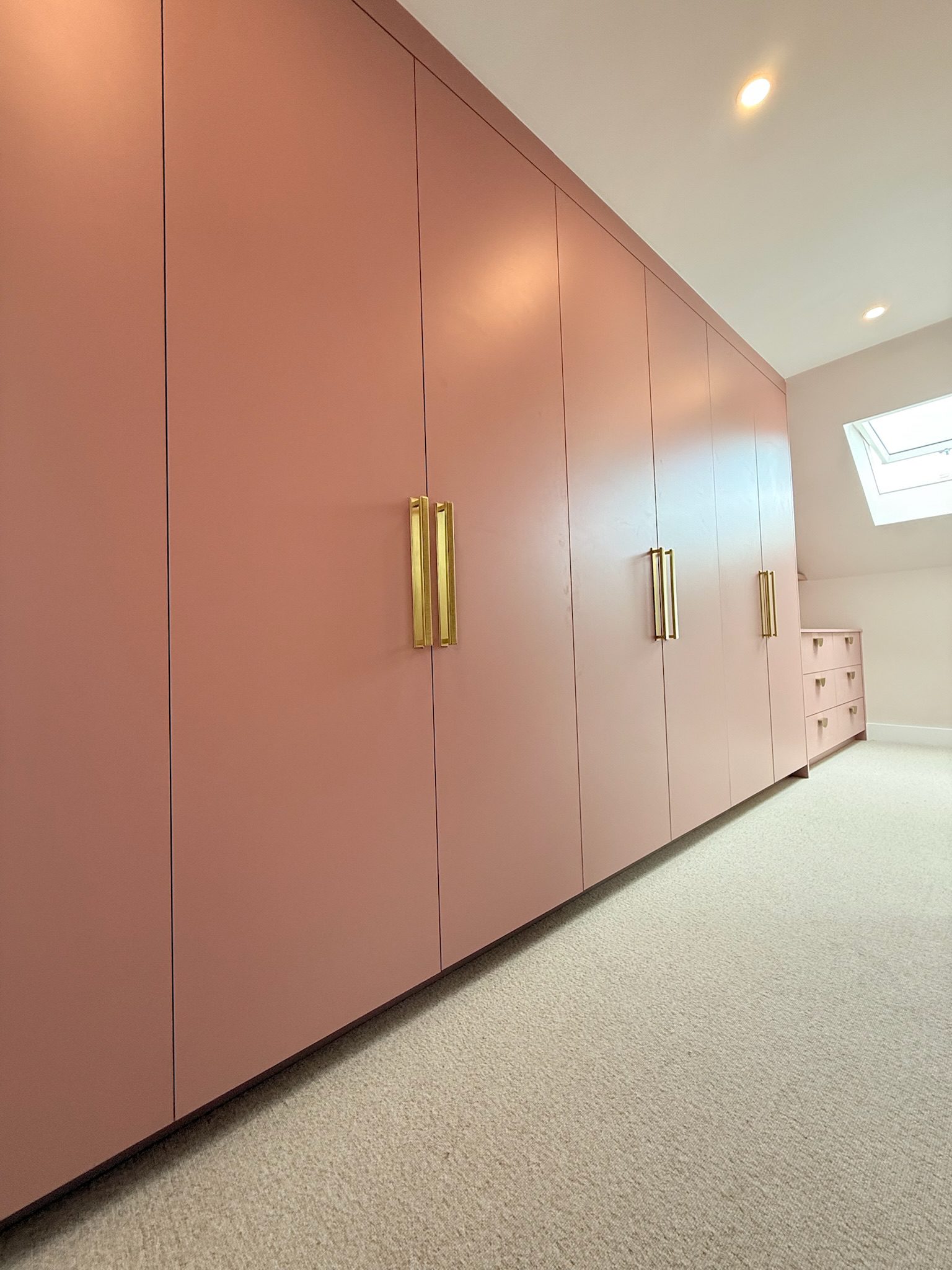 Pink wardrobes with gold handles
