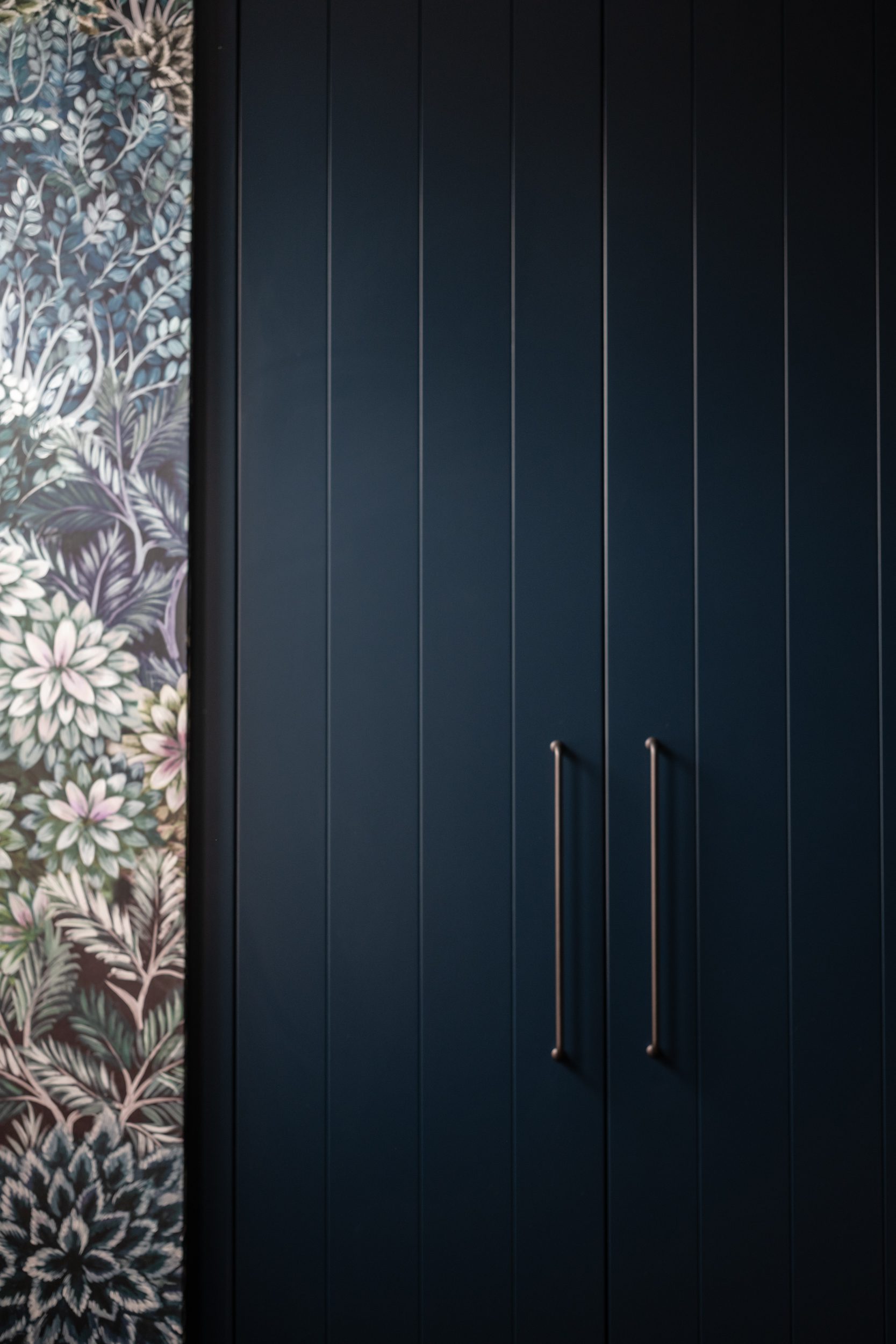 Elegant navy blue wardrobe doors with simple handles