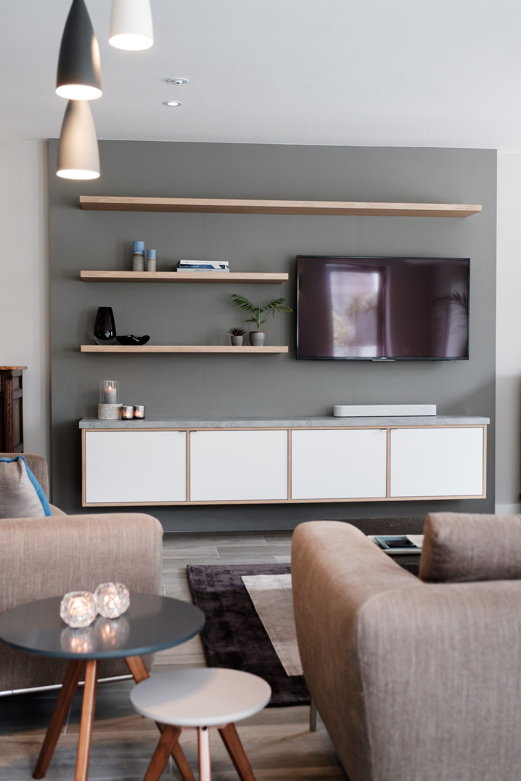 Grey living room with white cabinets