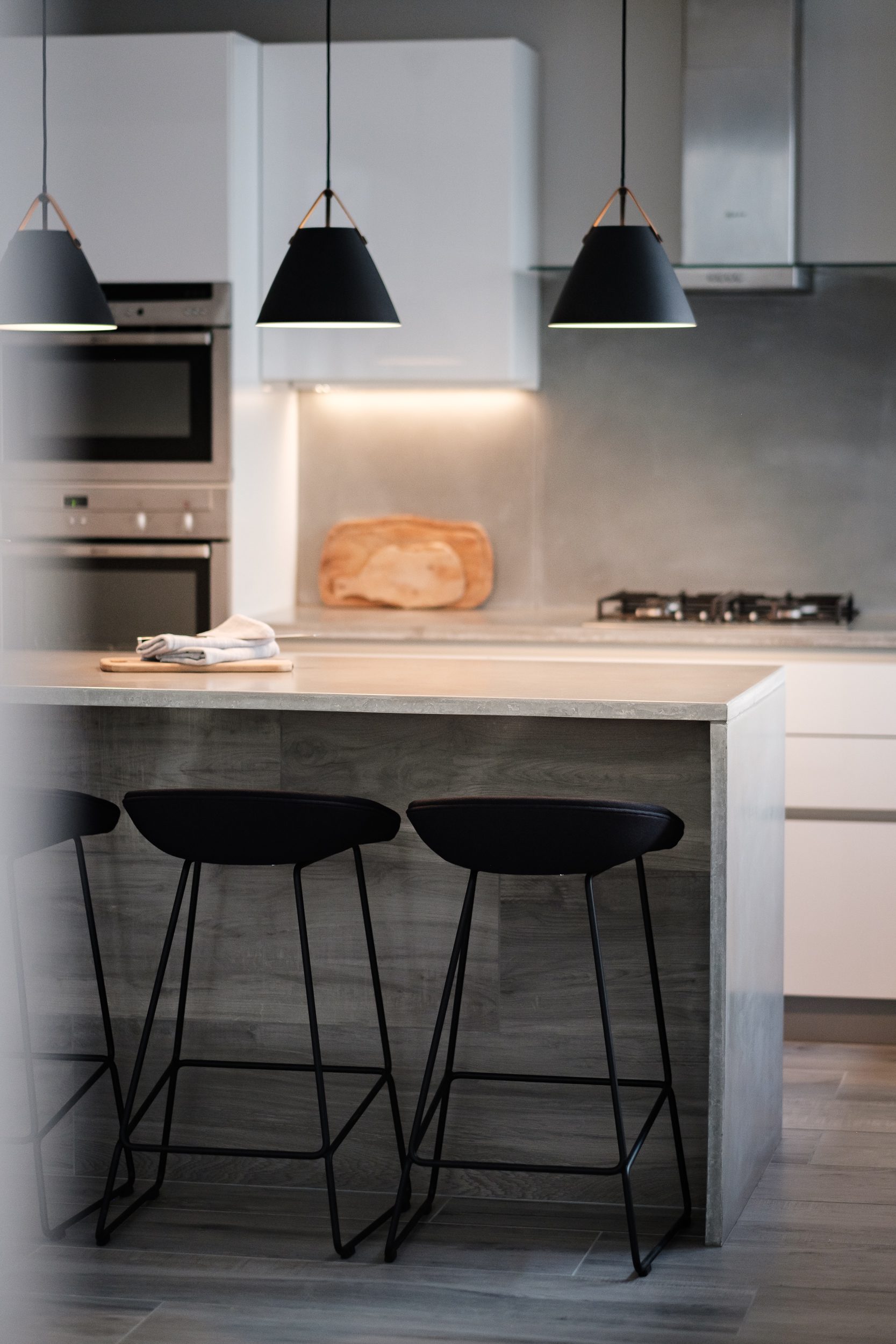 Bespoke kitchen island with handleless cabinetry and modern breakfast bar