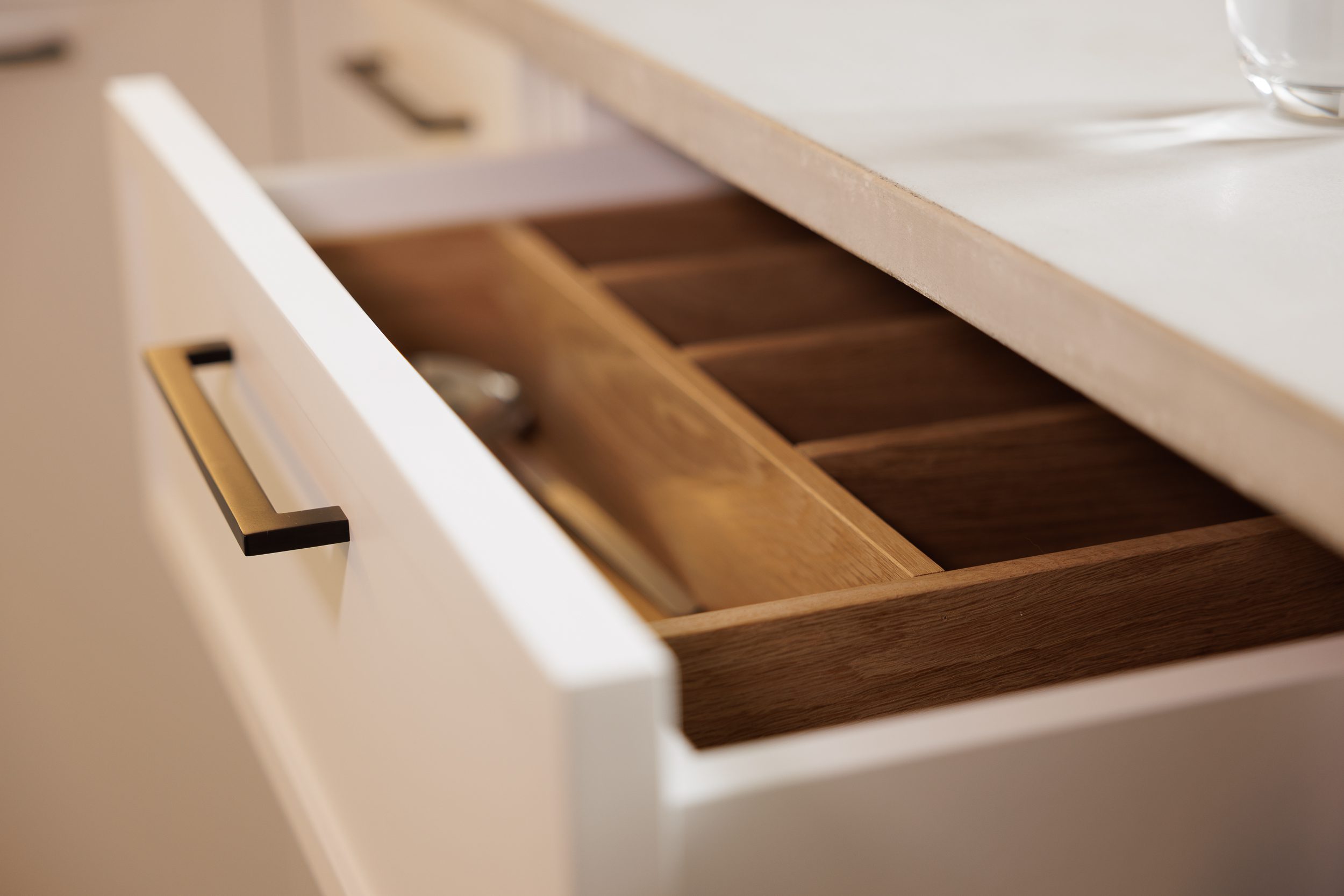 White drawer with bronze handles with inner draw
